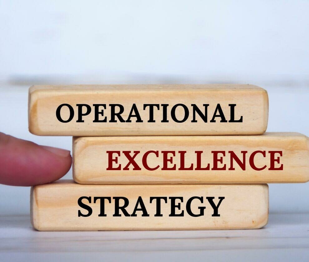 Hand,Pointing,Operational,Excellence,Strategy,Text,On,Wooden,Blocks.,Operational